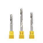 Three solid carbide 6mm single flute CNC router bits standing upright.