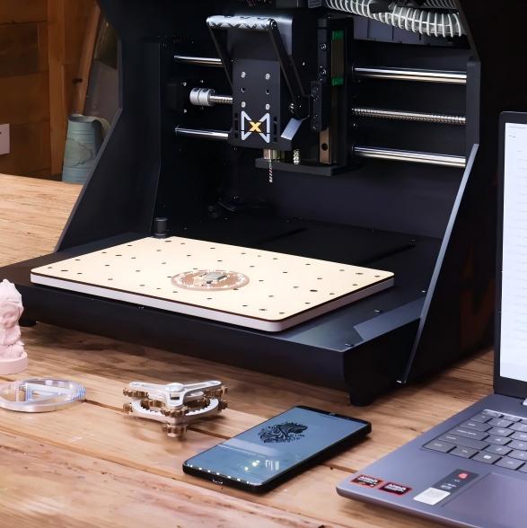 Through-cutting operation on HiMill CNC using sacrificial MDF spoilboard.